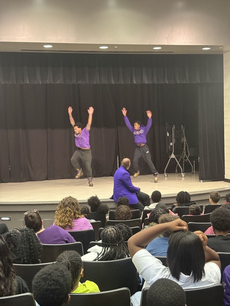 Omega Psi Phi fraternity brother doing a march for Mr. Shipman at the October community meetings.