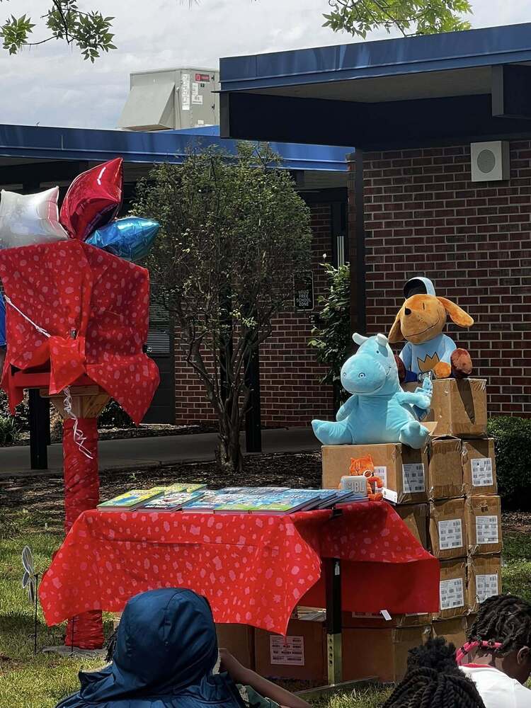 A covered Little Library dedication display waits to be revealed during the special ceremony