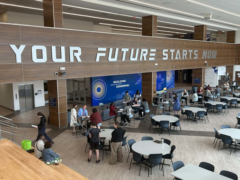 Picture of the cafetorium of the Huntsville Center for Technology. The words "Your Future Starts Now" is featured on the wall.
