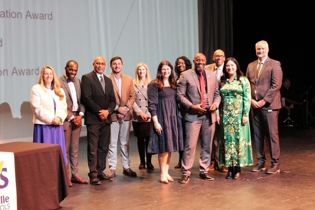 Williams Middle School team accepting their award for report card growth.