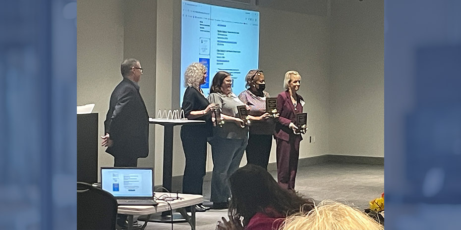 Dr. Cherryl Phillips-Walker and Mrs. Julia Morrobel receiving plaques for their LAMP awards from state representatives