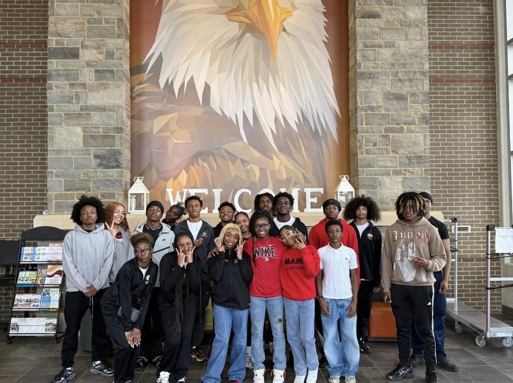 Student athletes  from Columbia High School posing in the lobby of Morris Elementary for a picture