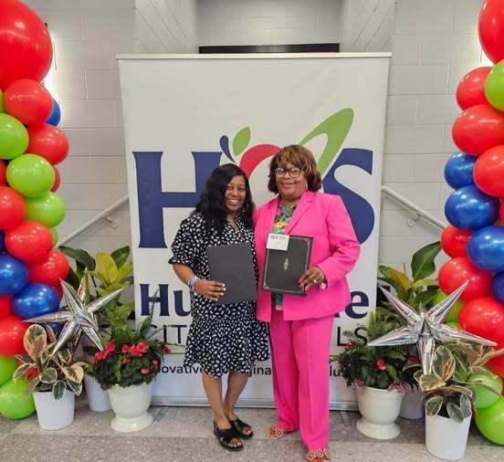 Ms. Danner and Mrs. Rice smile for a photo with their awards