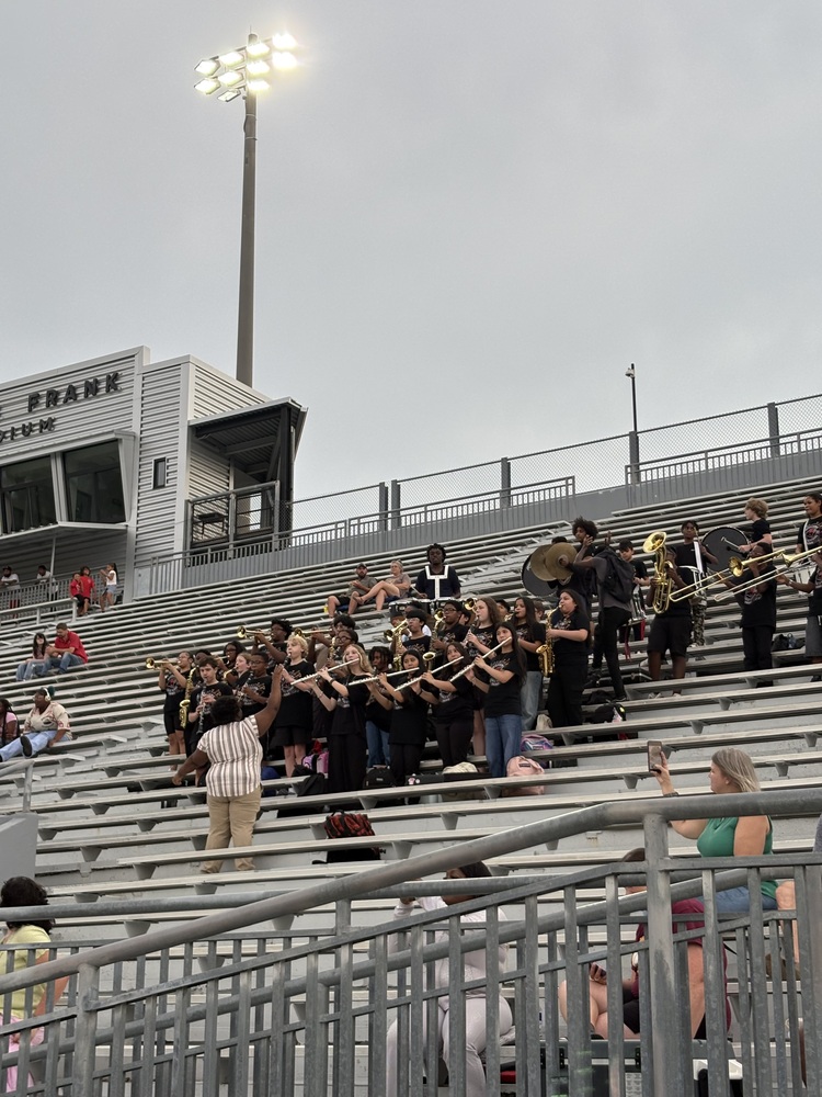 The WMS band in the stands playing at the Bird Bowl football game.
