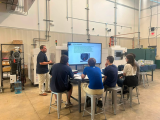 5 Engineering Design students being taught by Auburn University about metal condensation