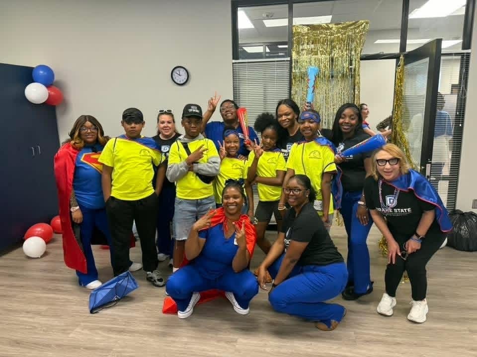 5th grade students pictured in lime green with drake staff in blue and  black shirt pictured 