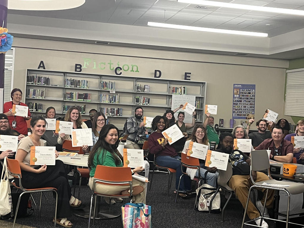 Teachers from LHS Feeder show their COMP training certificates at the conclusion of the training