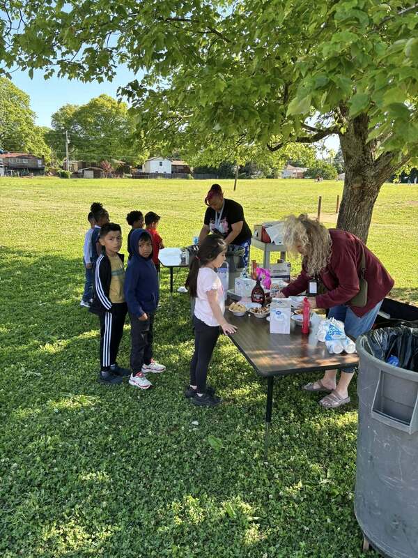 Ice cream sundae setup outside.