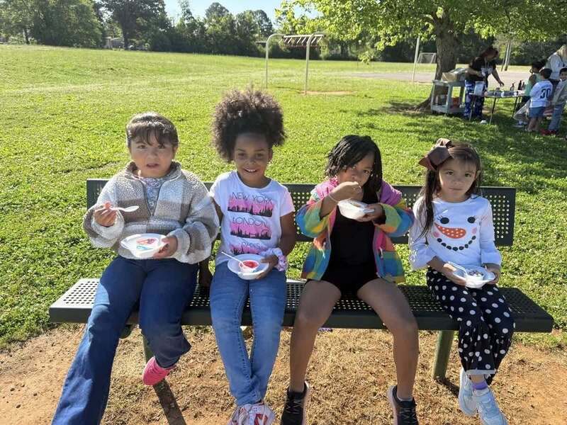 Students enjoying their ice cream and the beautiful weather.