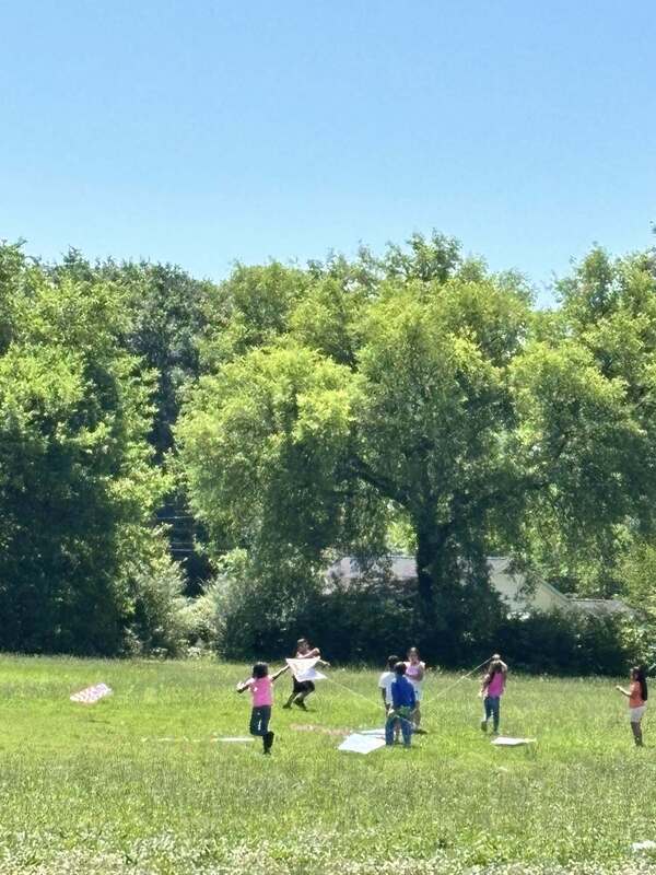 Students flying kites for their PBIS reward.