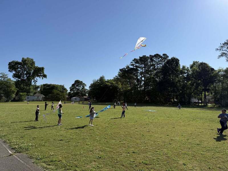 Students enjoying the beautiful windy day which was perfect for kite flying.