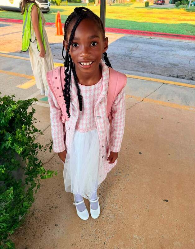 A 2nd grader dressed up for Fancy Friday.