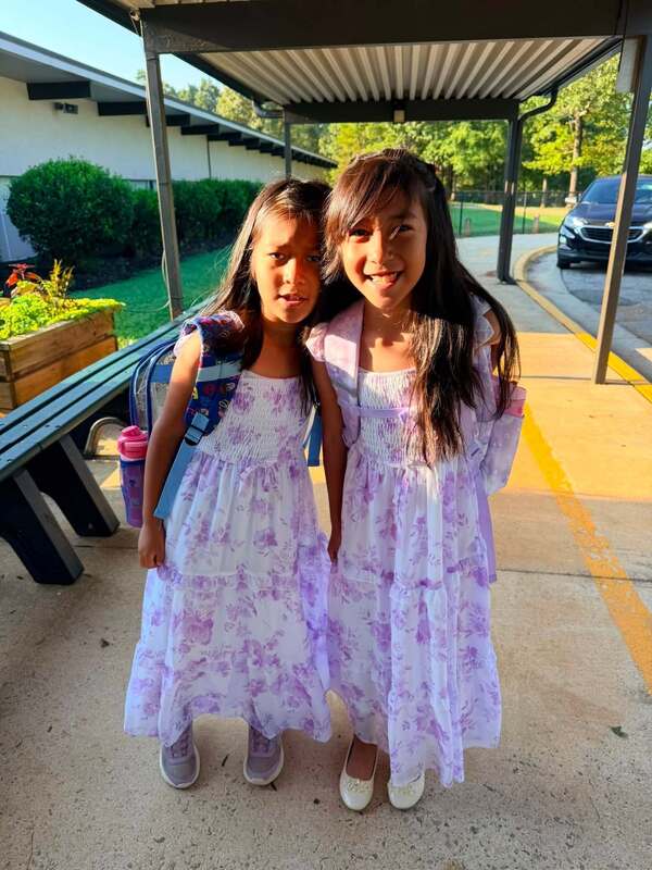 Sisters dressed up in beaituful dresses for Fancy Friday.