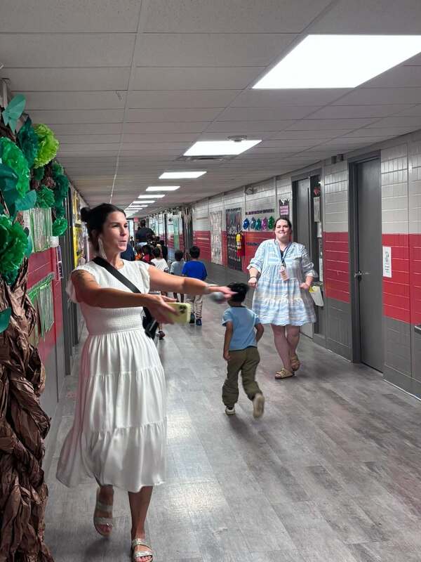 Assistant Principal Ms. Brandon leading our School Stroll after he assembly.