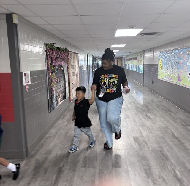 Mrs. Arnold and student enjoying the music in the School Stroll.