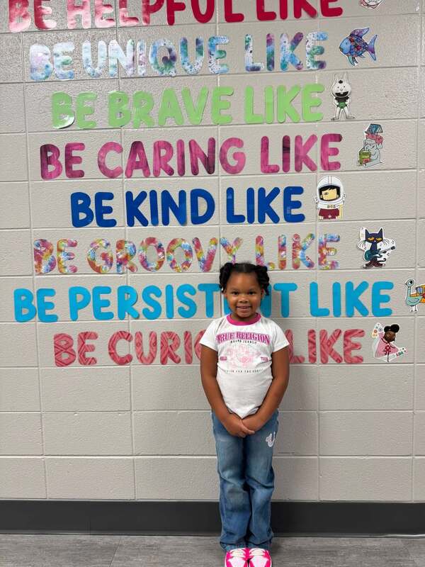 Our Kindergarten student of the month posing for her picture