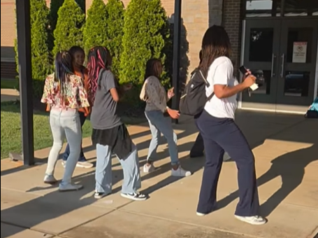 Mrs. Lattimore joins students in a line dance