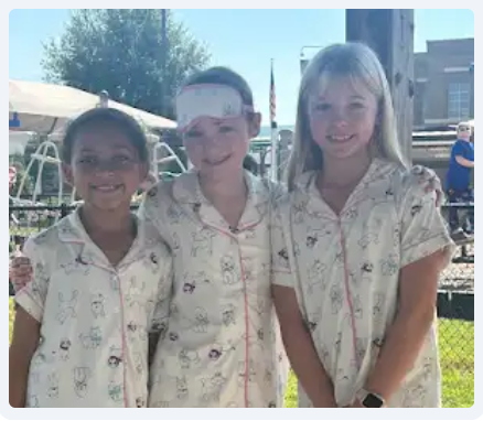 Three girls in matching Pajamas for Pajama Day during College and career week