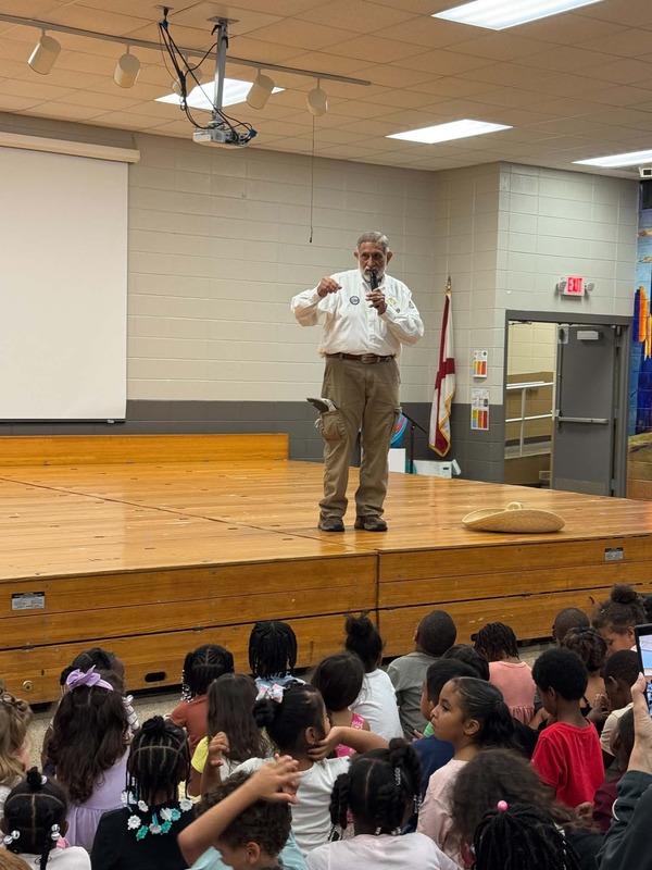 Mr. Rudy on stage giving his lesson on Spanish.