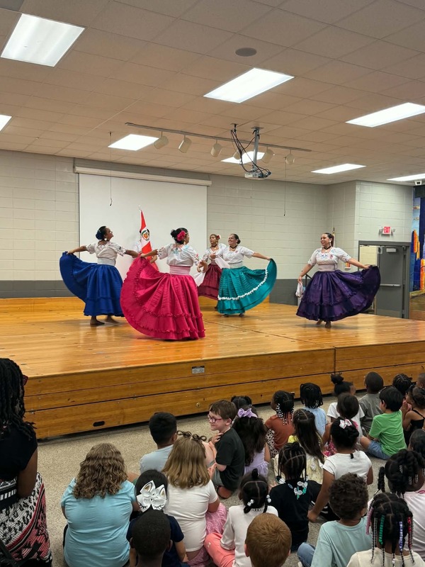 The Peruvian Latin Roots dancing and showing off their dresses.
