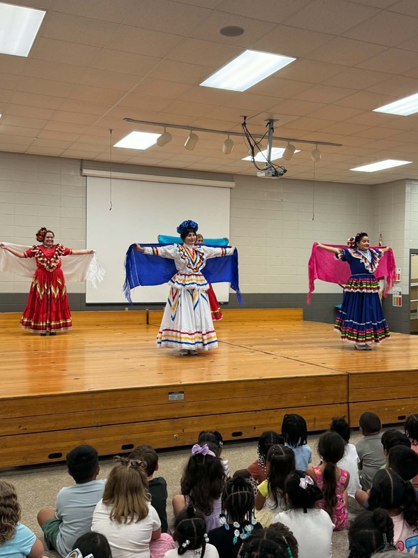 The Mexican Latin Roots dancers showing off their shawls.
