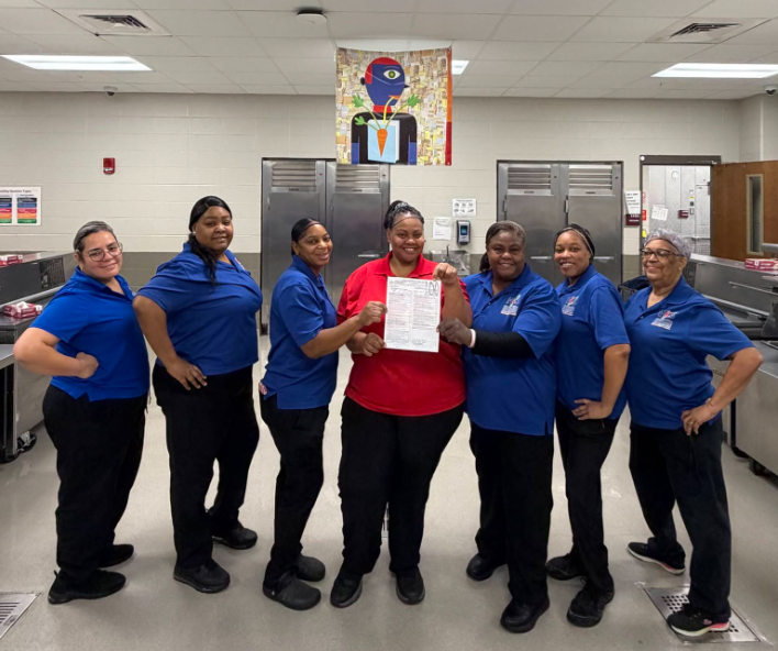 7 ladies wearing HCS CNP shirts pose with their perfect inspection score