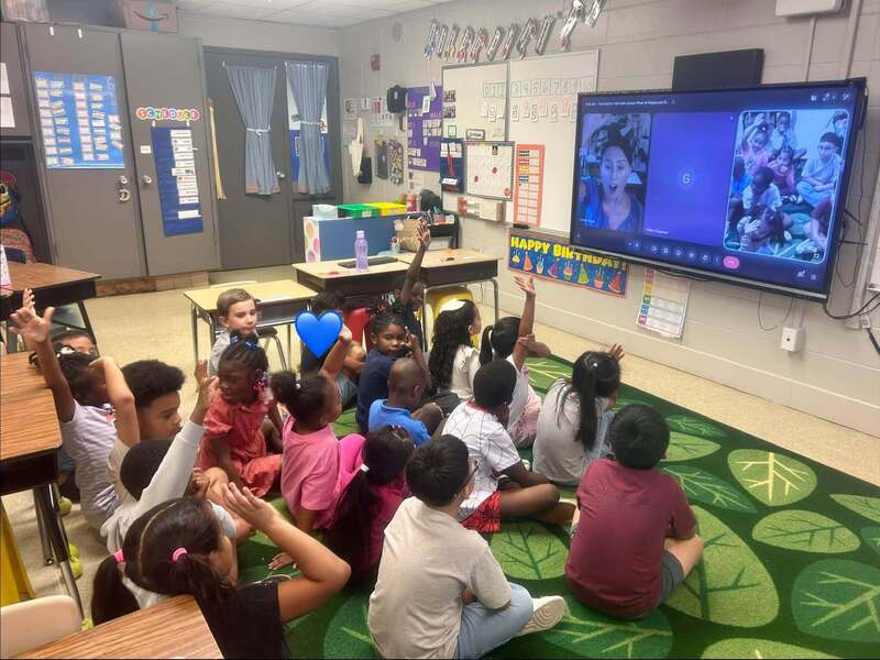 First graders enjoying their virtual visit with Illustrator LeUyan Pham