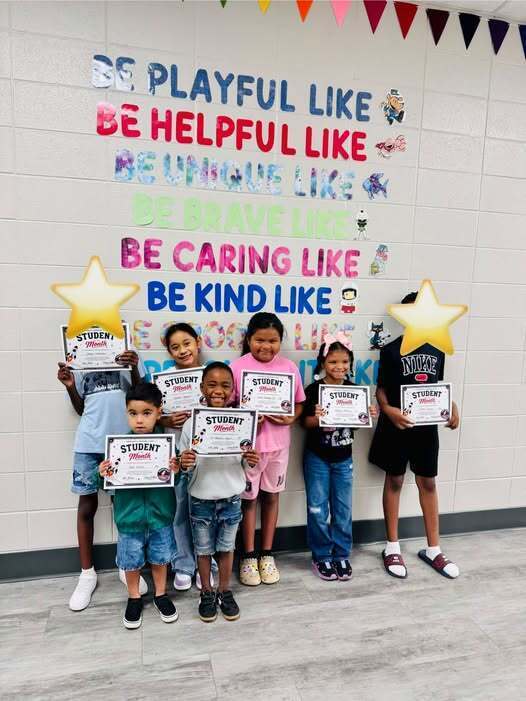Our September Students of the Month posing with their certificates