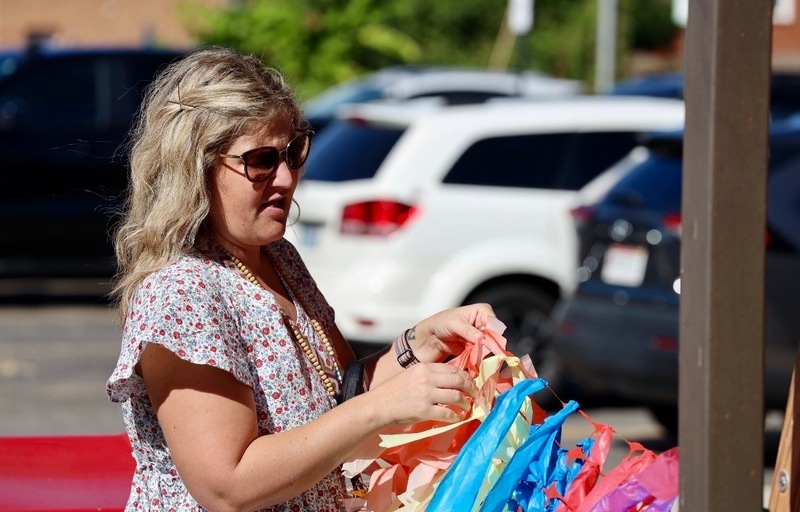 Mrs. Preston unraveling one of the decorations before the event.