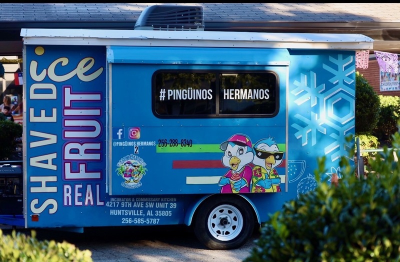 Pinguinos Raspados shaved ice truck at the celebration.
