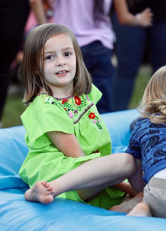 Student enjoying the bounce pad at the celebration.