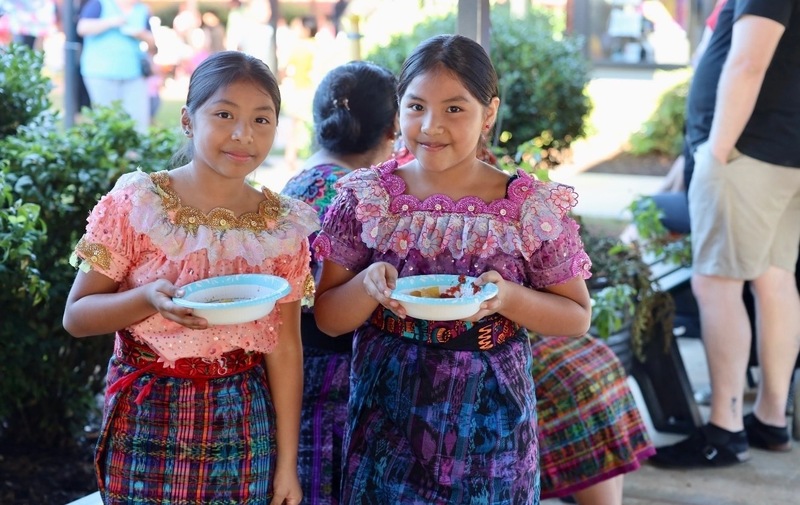 Students enjoying snacks at the celebration.