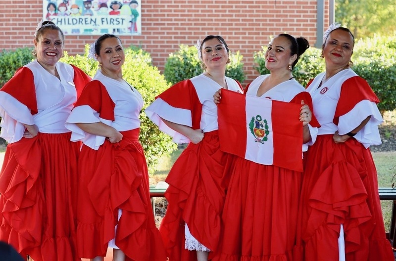 Latin Roots Folklore before performing at the celebration.