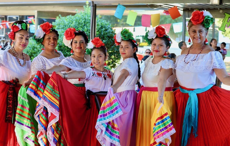 Latin Roots Folklore before performing at the celebration.