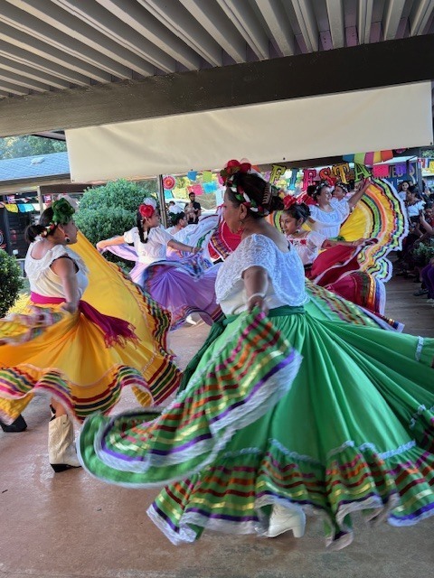 Latin Roots Folklore dancers performing for Ridgecrest families.