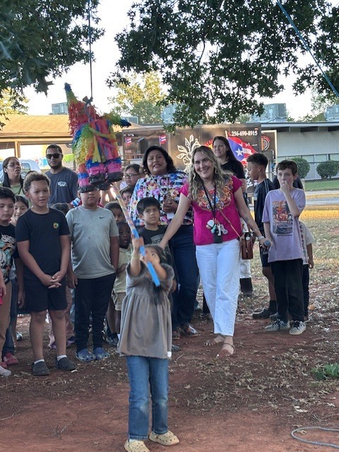 Student hitting the pinata.