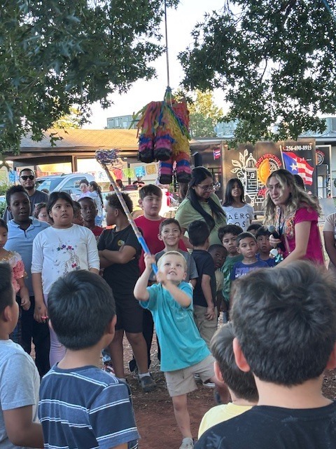 Student trying to break the donkey pinata.