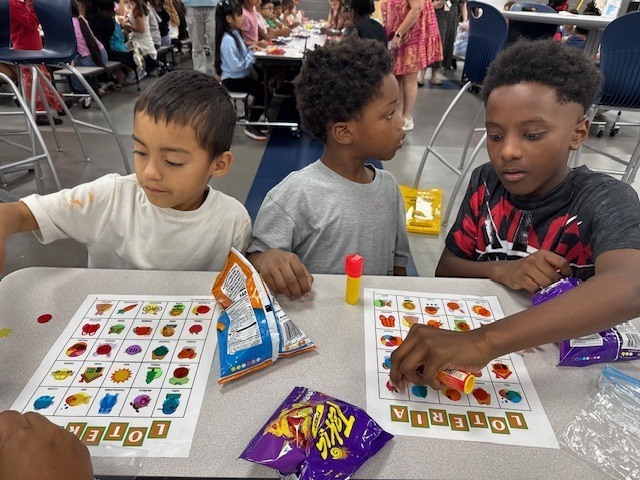 First and fourth graders playing loteria.