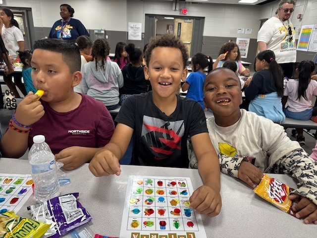 Students enjoying playing loteria together.