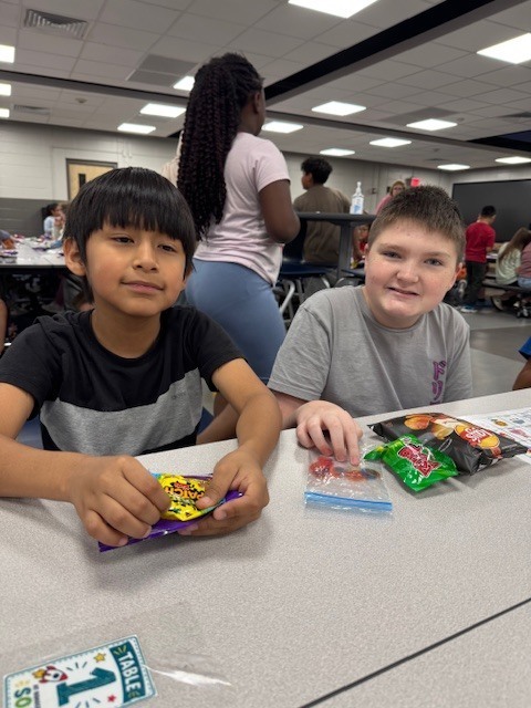 Third and fifth graders partnered up for loteria.