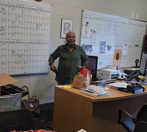 Dr. Burruss looking suprised as she was presented with the first competitor of the scavenger hunt.