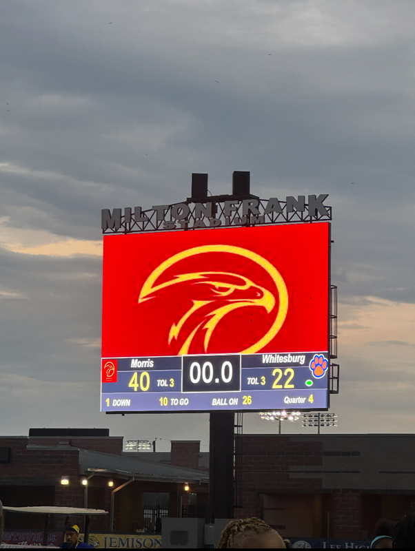 A red and gold Eagles lego lights up the scoreboard at Milton Frank Stadium. The score is 40 to 22.