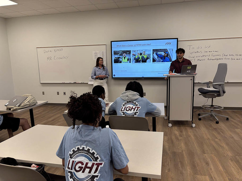 Students learning about MTM careers from LIGHT Instructors