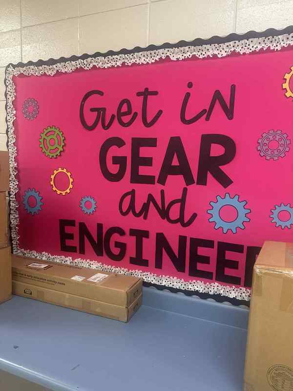 Photo of a bulletin board that says "Get in Gear and Engineer"