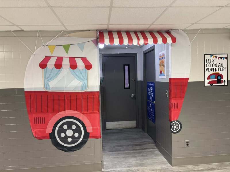 Outside our Principal's office is decorated like a camper!