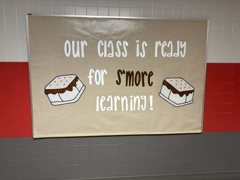 A s'more themed bulletin board with the words "Our class is ready for s'more learning!"