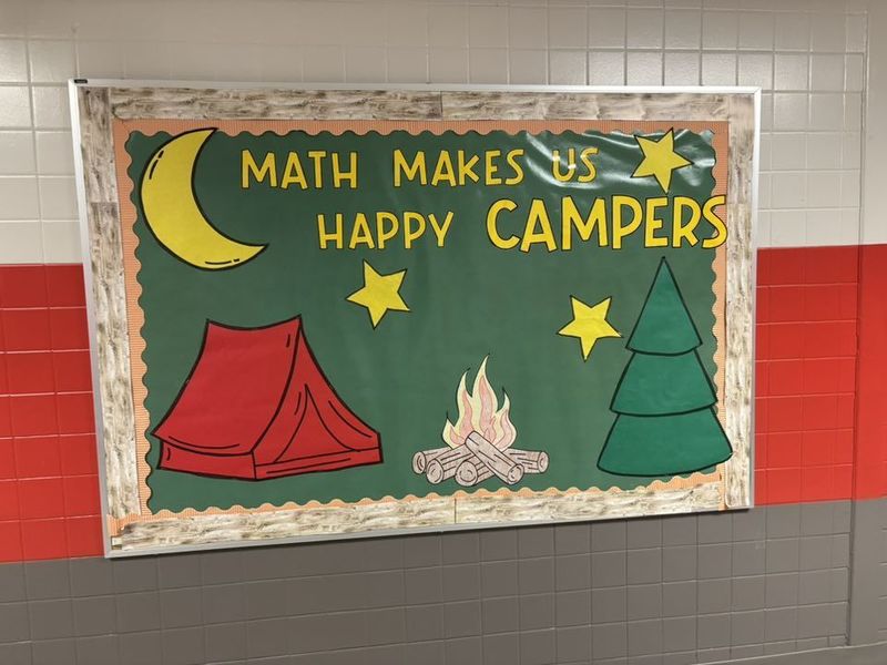 Math Makes Us Happy Campers bulletin board at the end of the 5th grade hallway