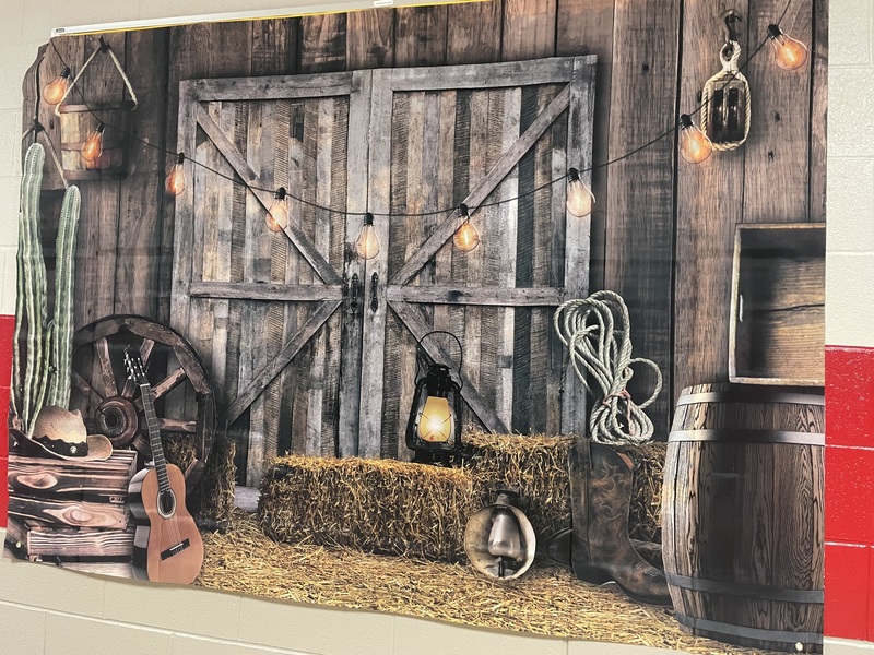 Country mural on Bulleting Board in hallway with gray barn doors, hay stack, guitar