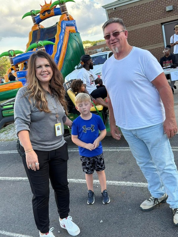 Nurse McDonald with grandson and husband at Spirit Night