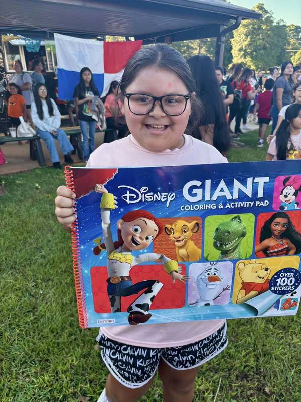 Student who won a prize at Loteria! It was a giant Disney coloring book.